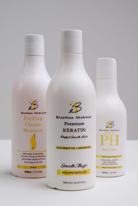 Three Brazilian Shekinah hair care products: Purifying Cleanse Shampoo, Premium Keratin treatment, and PH Shampoo bottles displayed on white background