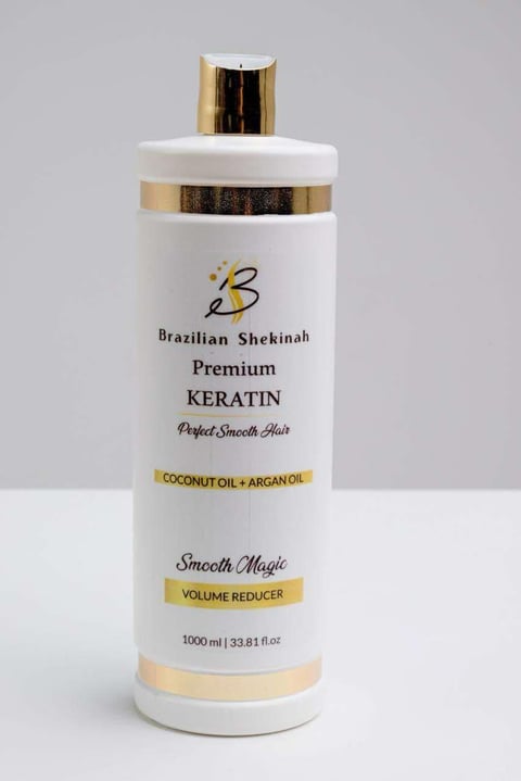Brazilian Shekinah Premium Keratin hair treatment bottle with coconut oil and argan oil, 1000ml size, featuring gold accents and white cylindrical packaging