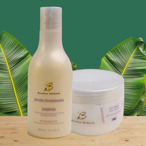 Two hair care products from Brazilian Shakebrush brand - a keratin shampoo bottle and treatment jar displayed with green banana leaves on wood surface