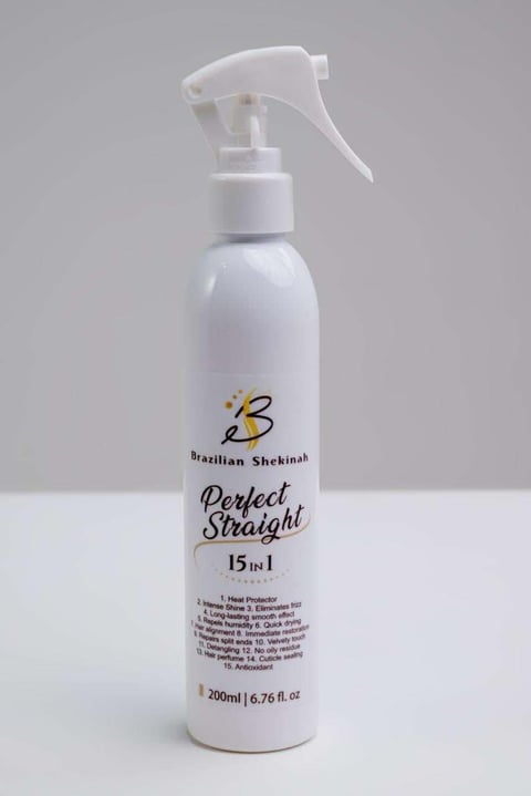 White spray bottle of Brazilian Shekinal Perfect Straight 15 in 1 hair treatment product, 200ml, with spray trigger applicator on gray background